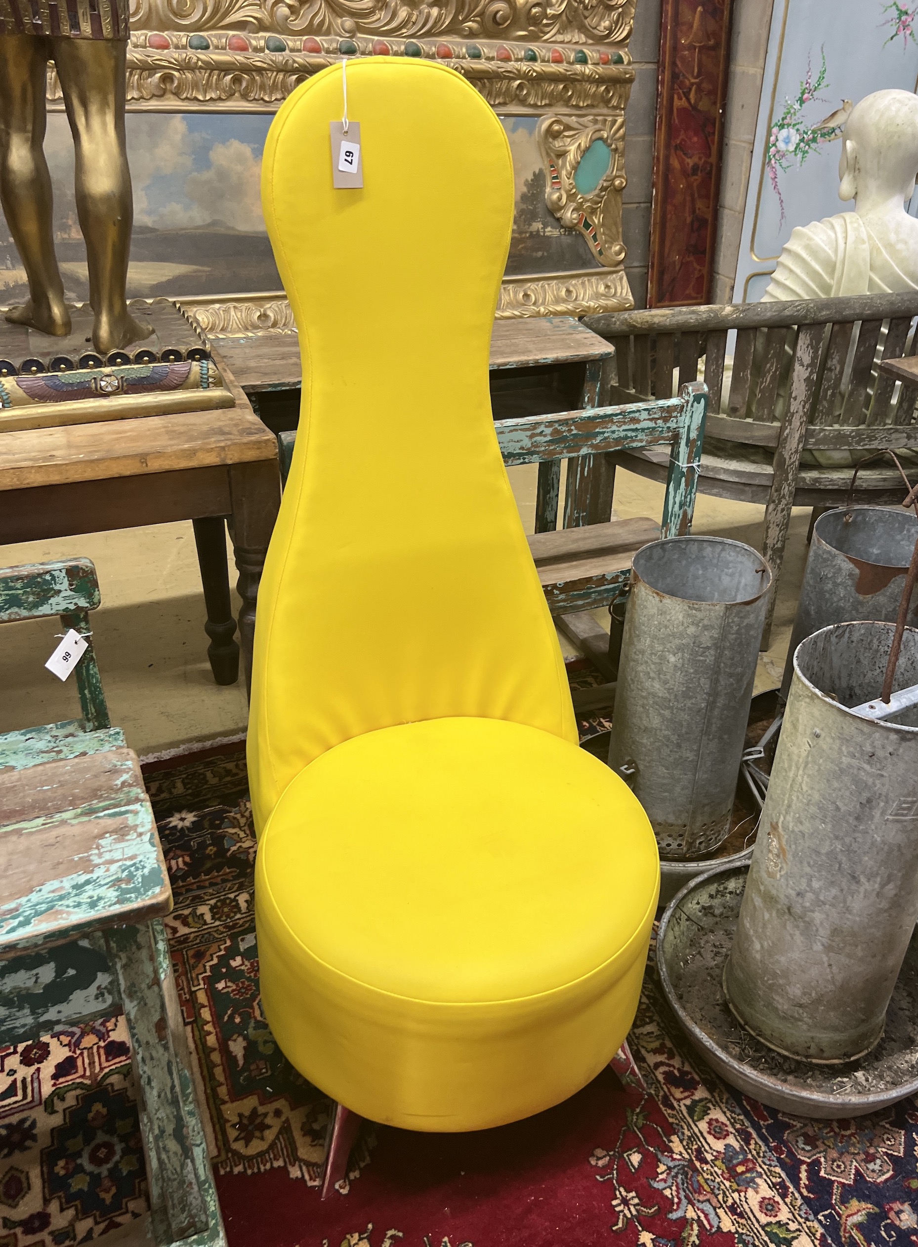 A contemporary yellow high back chair with circular seat, width 51cm, height 126cm